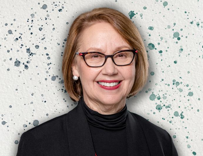 Headshot of AG Ellen Rosenblum in a black suit overtop an off-white background with blue and green spatter